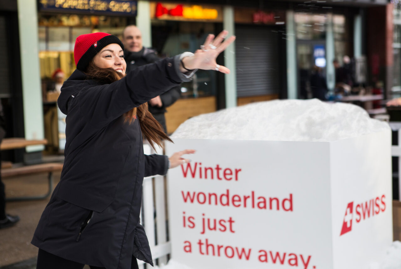 A woman throws a snowball