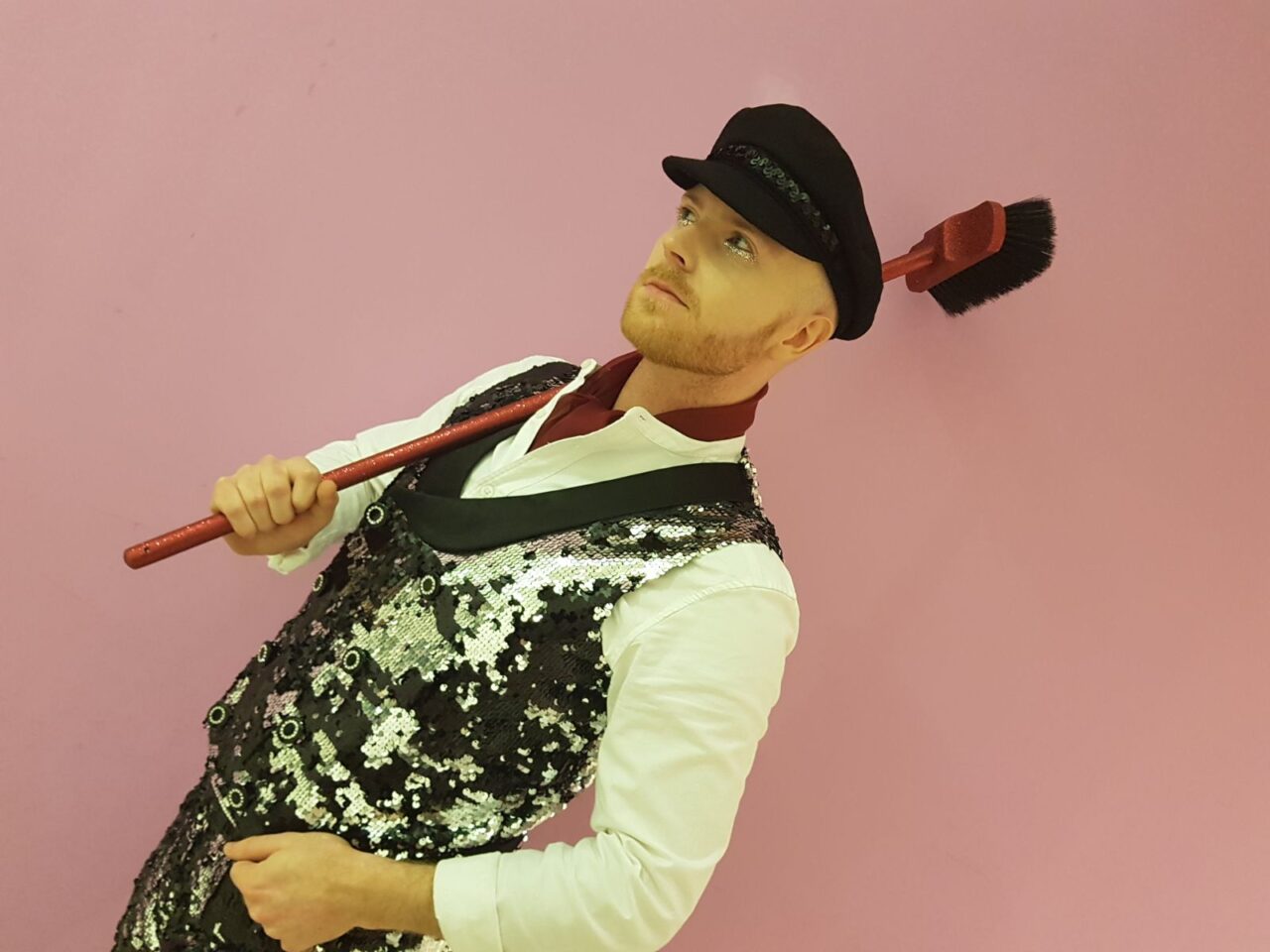 Pearly king in front of pink background