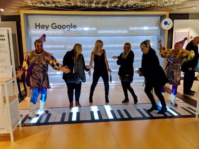 Joy Jesters dance on the giant floor piano