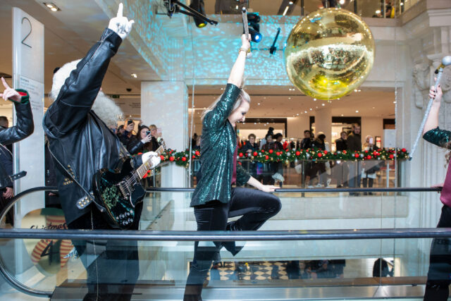 A procession of rock dancers and rock santa