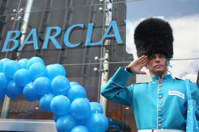 A guard stands to attention outside Barclays