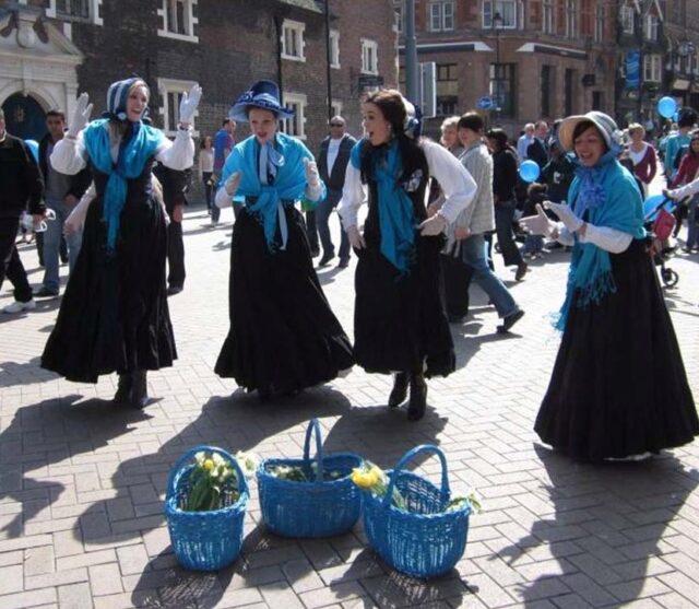 Flower girls dance outside Barclays