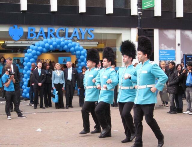 Guards walk in a routine outside Barclays