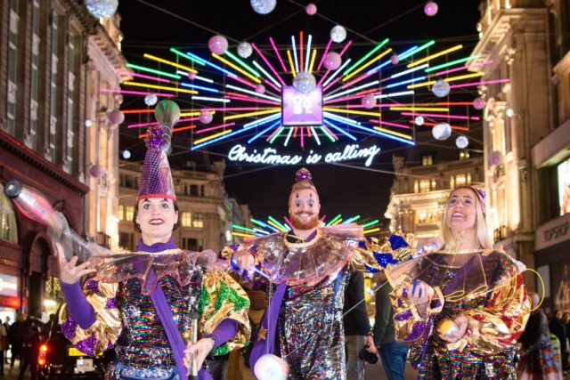 joy jester under the Christmas lights