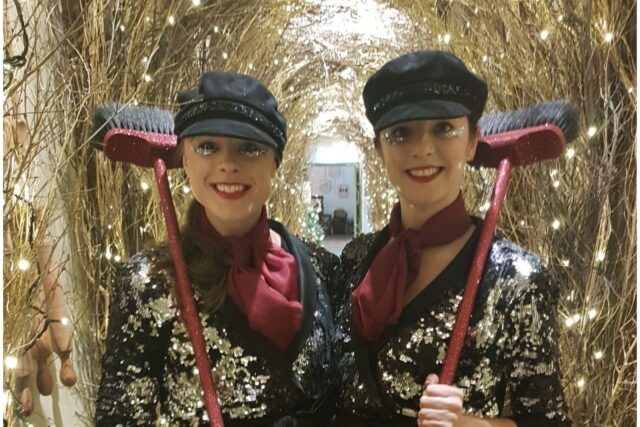 two pearly queens in glittery tunnel